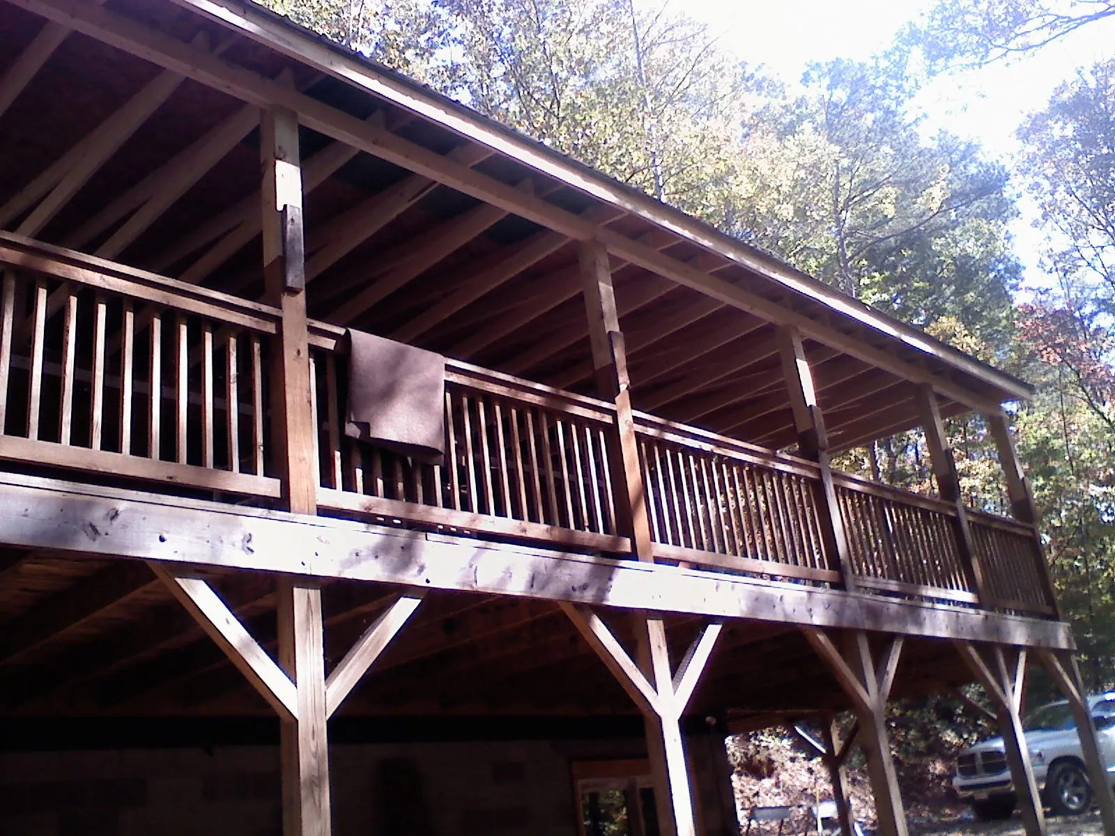 Timber framing under a new elevated porch and deck — Roof Leak Repair in Crookston by Roofing Brothers